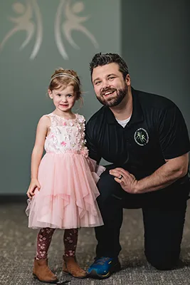 Chiropractor Anoka MN Aaron Frach With Child